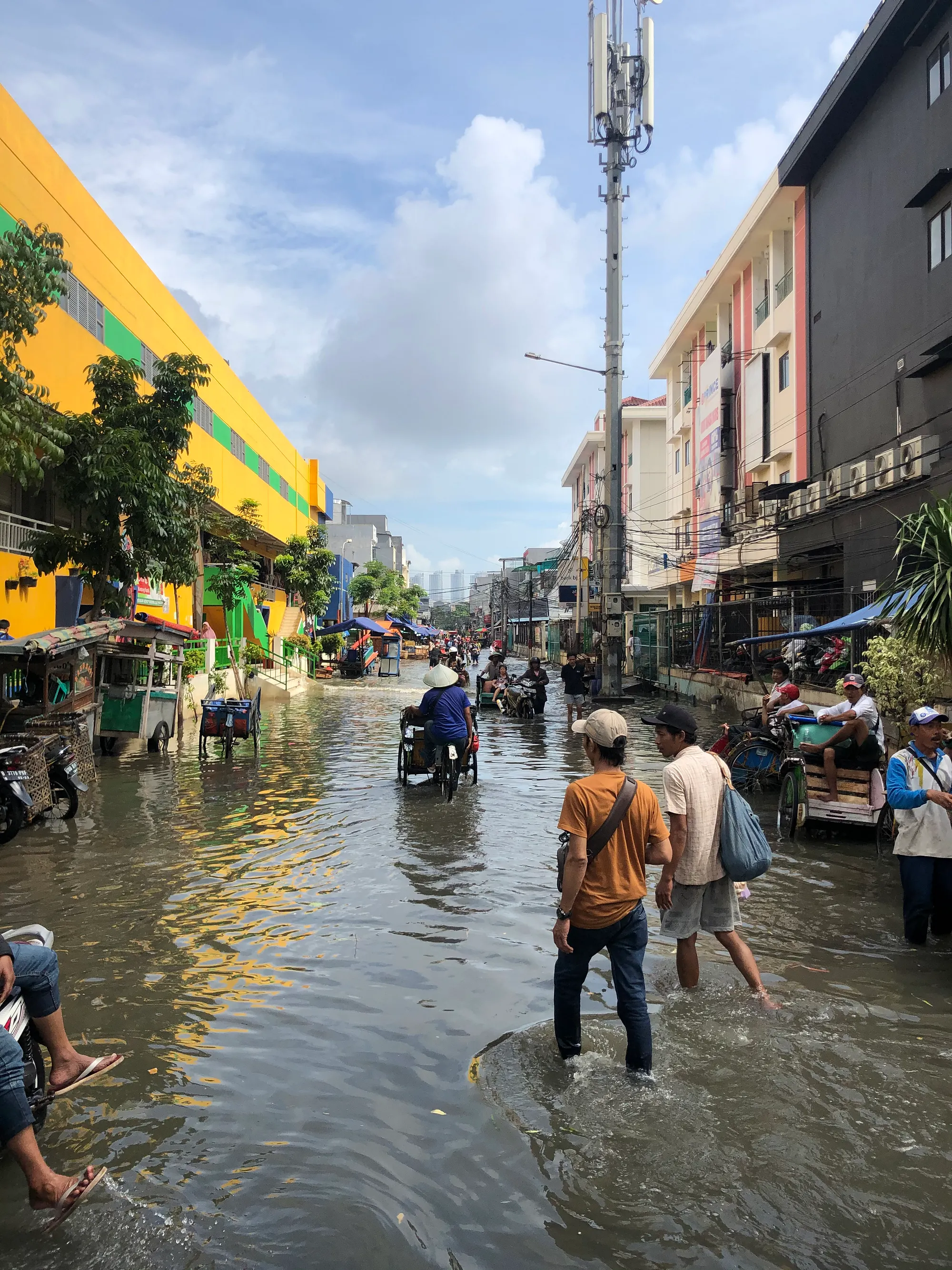 Wading through Jakarta floods
